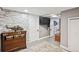 Finished basement featuring a stone accent wall and entertainment area at 2865 Newland St, Wheat Ridge, CO 80214