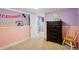 Inviting bedroom with two-tone walls, creating a cozy atmosphere at 2865 Newland St, Wheat Ridge, CO 80214