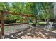 Inviting deck offers a bar, lounge seating, overhead string lights, and views of the mature backyard at 2865 Newland St, Wheat Ridge, CO 80214
