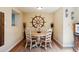 Charming dining room featuring a decorative ship's wheel and a cozy round table at 2865 Newland St, Wheat Ridge, CO 80214