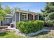 Charming home featuring a red front door and an adjacent garden at 2865 Newland St, Wheat Ridge, CO 80214