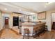 Eat-in kitchen features stainless steel appliances, light wood cabinets, granite countertops, and a breakfast bar at 2865 Newland St, Wheat Ridge, CO 80214