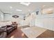 Bright living area featuring hardwood floors, a staircase, and stylish wall trim at 2865 Newland St, Wheat Ridge, CO 80214