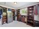 Spacious walk-in closet with custom wooden shelving and organizational units with natural light at 2865 Newland St, Wheat Ridge, CO 80214
