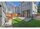 Outdoor living space featuring a patio, artificial turf, and wood fence at 1437 Garfield St, Denver, CO 80206