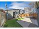 Modern backyard with artificial turf, patio and privacy fence, ideal for outdoor relaxation at 1437 Garfield St, Denver, CO 80206