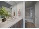 Stylish bathroom with a double vanity, quartz countertop, and glass-enclosed shower with modern tile at 1437 Garfield St, Denver, CO 80206