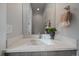 Contemporary bathroom features a stylish vanity with a sleek faucet, framed mirror, and elegant decor at 1437 Garfield St, Denver, CO 80206