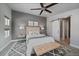 The bedroom features a modern sliding barn door entrance and a neutral color palette at 1437 Garfield St, Denver, CO 80206