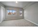 An airy bedroom with neutral walls, carpet, and ample natural light from well-placed windows at 1437 Garfield St, Denver, CO 80206