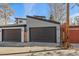 Modern home with large garage doors, offering ample parking and storage space at 1437 Garfield St, Denver, CO 80206