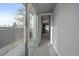 Bright hallway with sliding glass doors to an outdoor balcony, providing ample natural light at 1437 Garfield St, Denver, CO 80206