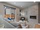 Cozy living room with fireplace, modern decor, and sliding door access to the outdoor patio at 1437 Garfield St, Denver, CO 80206