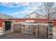 Outdoor kitchen with built in barbeque, sink, and storage at 15776 E 107Th Way, Commerce City, CO 80022