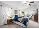 Large main bedroom with vaulted ceilings, bay windows, and ensuite bathroom at 15776 E 107Th Way, Commerce City, CO 80022
