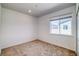 Spacious bedroom with a window and carpet flooring at 23881 E 40Th Ave, Aurora, CO 80019