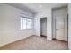 Well-lit bedroom featuring a window, closet, and carpet at 23881 E 40Th Ave, Aurora, CO 80019