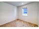 Simple bedroom with carpet and a window offering natural light at 23881 E 40Th Ave, Aurora, CO 80019