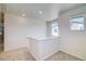 Upstairs hallway with carpet and a window overlooking the neighborhood at 23881 E 40Th Ave, Aurora, CO 80019