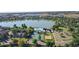 Beautiful aerial view of community amenities with lake, pool, tennis courts, and beach volleyball at 13307 Humboldt Dr, Thornton, CO 80241