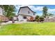This spacious backyard features a well-maintained lawn, patio area, and mature trees, offering ample space for recreation at 13307 Humboldt Dr, Thornton, CO 80241