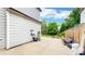 A well-maintained lawn with a mower kept near a fence and a small patio at 13307 Humboldt Dr, Thornton, CO 80241