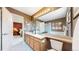 A bathroom includes a double sink vanity, large mirror, and a nearby bedroom at 13307 Humboldt Dr, Thornton, CO 80241