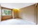 This large empty bedroom boasts natural light and neutral carpeting at 13307 Humboldt Dr, Thornton, CO 80241