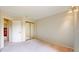 Spacious bedroom with closet and neutral carpeting and a door leading to the rest of the house at 13307 Humboldt Dr, Thornton, CO 80241