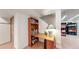 Dedicated nook with wooden desk, shelving, and lighting provides the perfect space for work or hobbies at 13307 Humboldt Dr, Thornton, CO 80241