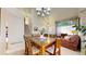 Dining area with a spacious table set, staircase and entry to the living room at 13307 Humboldt Dr, Thornton, CO 80241