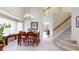 Elegant dining area with stairs and natural light at 13307 Humboldt Dr, Thornton, CO 80241