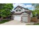 Charming two-story home features a three-car garage and well-manicured lawn in a desirable neighborhood at 13307 Humboldt Dr, Thornton, CO 80241