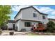 Exterior view of the house from the backyard featuring multiple windows, decks, and a well-kept lawn at 13307 Humboldt Dr, Thornton, CO 80241