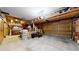 Spacious garage with storage, work area, and overhead door, suitable for projects and parking at 13307 Humboldt Dr, Thornton, CO 80241