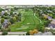 Beautiful aerial view of lush green golf course winding through a neighborhood at 13307 Humboldt Dr, Thornton, CO 80241