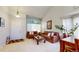 Bright living room with vaulted ceilings, large window, and comfortable seating at 13307 Humboldt Dr, Thornton, CO 80241