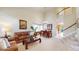 Inviting living room with high ceilings, neutral colors, and a staircase at 13307 Humboldt Dr, Thornton, CO 80241