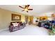 Open living area with a ceiling fan and adjoining kitchen space at 13307 Humboldt Dr, Thornton, CO 80241