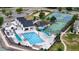 Aerial view of the community pool, playground, tennis court, and beach volleyball for outdoor recreation at 13307 Humboldt Dr, Thornton, CO 80241