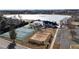 Aerial view of community featuring tennis courts, playground, and frozen lake at 13307 Humboldt Dr, Thornton, CO 80241