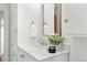 Bright bathroom with a modern sink, decorative mirror and freshly cleaned towels at 3400 Garland St, Wheat Ridge, CO 80033