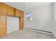 This bedroom features built-in storage and is lit by a window at 3400 Garland St, Wheat Ridge, CO 80033