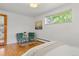 Bedroom featuring hardwood floors and lots of light with a soft, neutral color scheme at 3400 Garland St, Wheat Ridge, CO 80033