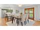 Bright dining area with a view of the backyard, adjacent to an open kitchen space at 3400 Garland St, Wheat Ridge, CO 80033