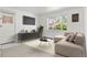 Cozy living room featuring neutral tones, a large window, and comfortable seating at 3400 Garland St, Wheat Ridge, CO 80033