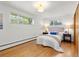 Bright main bedroom with hardwood floors, lots of natural light, and neutral décor at 3400 Garland St, Wheat Ridge, CO 80033