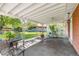 Covered patio with seating area overlooking the backyard at 3400 Garland St, Wheat Ridge, CO 80033