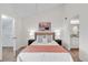 Cozy bedroom with a neutral color palette, featuring a walk-in closet and ensuite bathroom at 1862 Mallard Dr, Superior, CO 80027