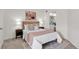 Serene bedroom with soft lighting, featuring an ensuite bathroom and plush carpeting at 1862 Mallard Dr, Superior, CO 80027
